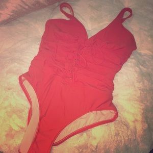 Burnt orange one piece swim wear.